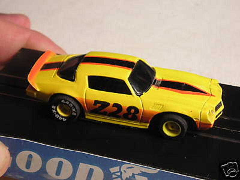 Tyco_79_Camaro_Z-28_slot_car_y-blk-or-r_1.JPG}